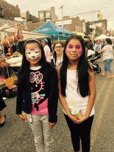 We think these girls look terrific with their faces painted!
